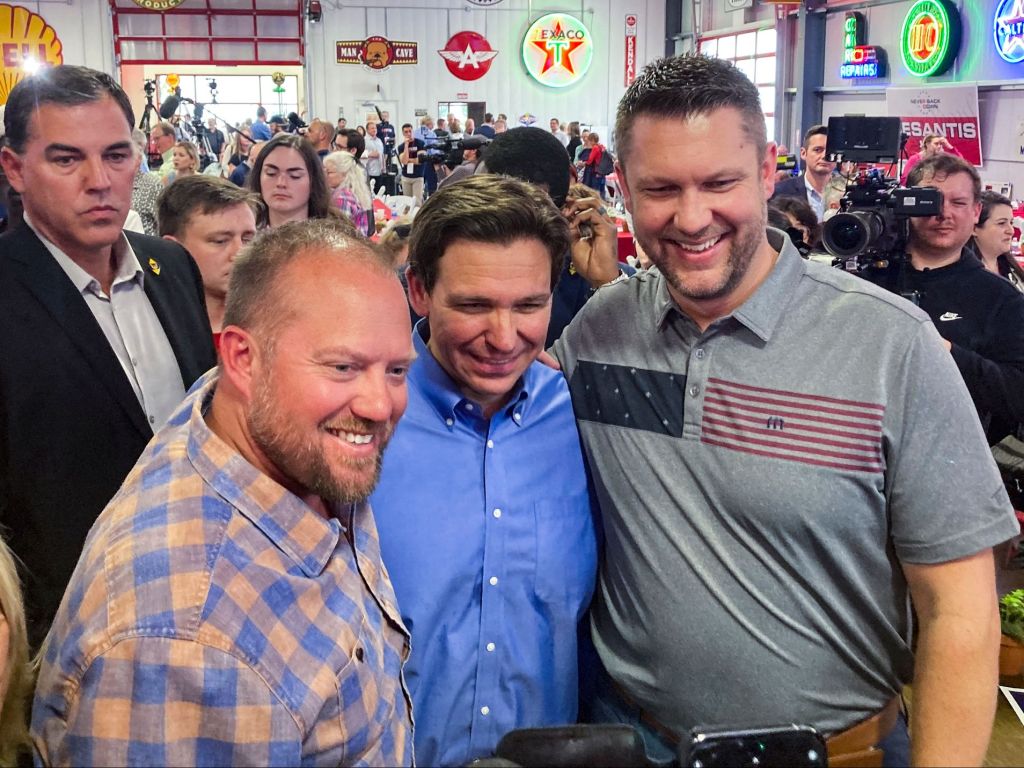 Florida Governor Ron DeSantis (center) poses for photographs after speaking during the Feenstra Family Picnic event in Sioux Center, Iowa on May 13th, 2023. (Photo by Léa DAUPLE / AFP) (Photo by LEA DAUPLE/AFP via Getty Images)
