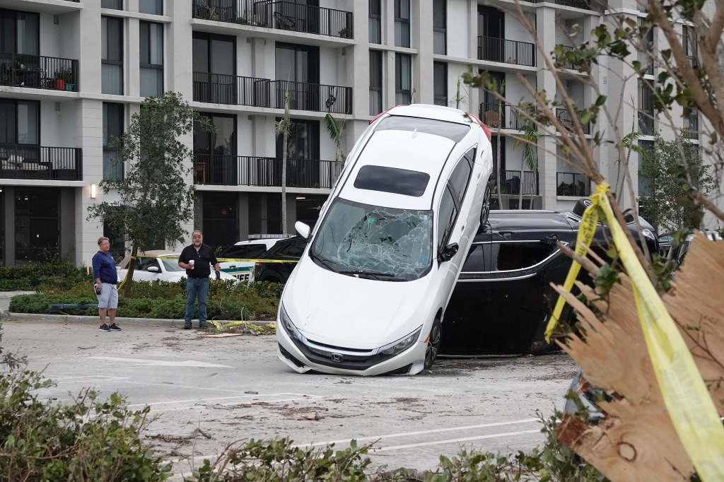 Cars stacked up on Sunday, April 30, 2023, at The Point at Palm Beach Gardens, Florida after a tornado moved through the area.