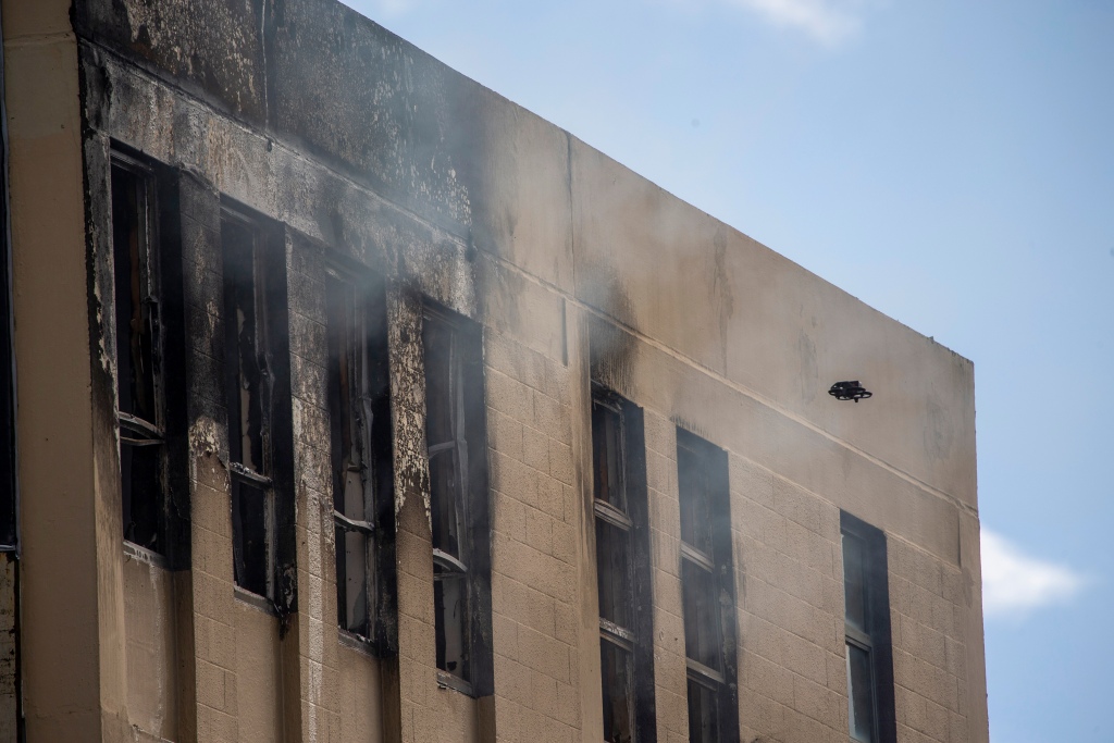 A drone inspects damage following a fire near a hostel in central Wellington, New Zealand,