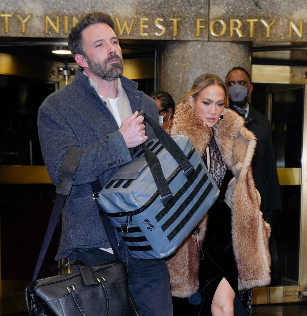 Stone faced Ben Affleck walks through New York with Jennifer Lopez in February. 