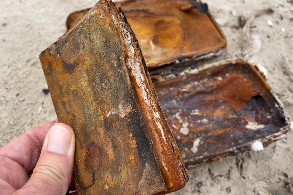 This old Bible in a barnacle-encrusted case is up for auction Saturday.