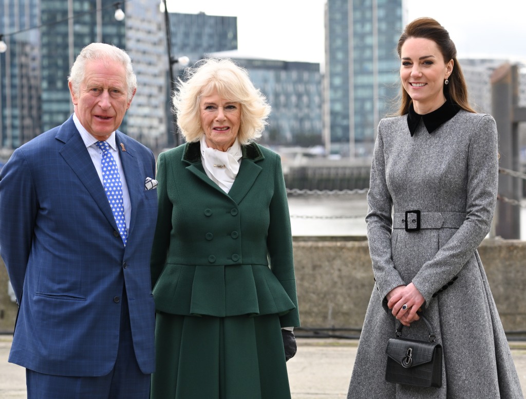 Then-Prince Charles (left), Camilla (center) and Kate Middleton (right) arrive for their visit to The Prince's Foundation training site for arts and culture at Trinity Buoy Wharf.