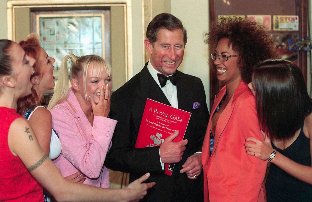 The Spice Girls giggled as Prince Charles showed off Geri's lipstick mark on his cheek.