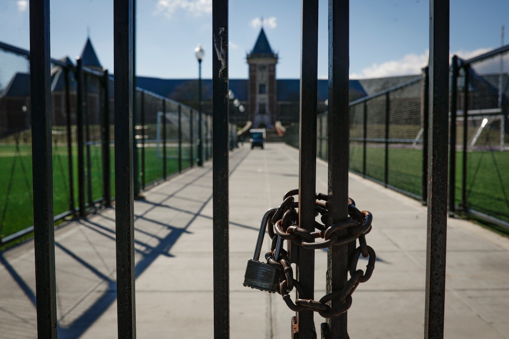 Padlocked gates in front of New Rochelle High School