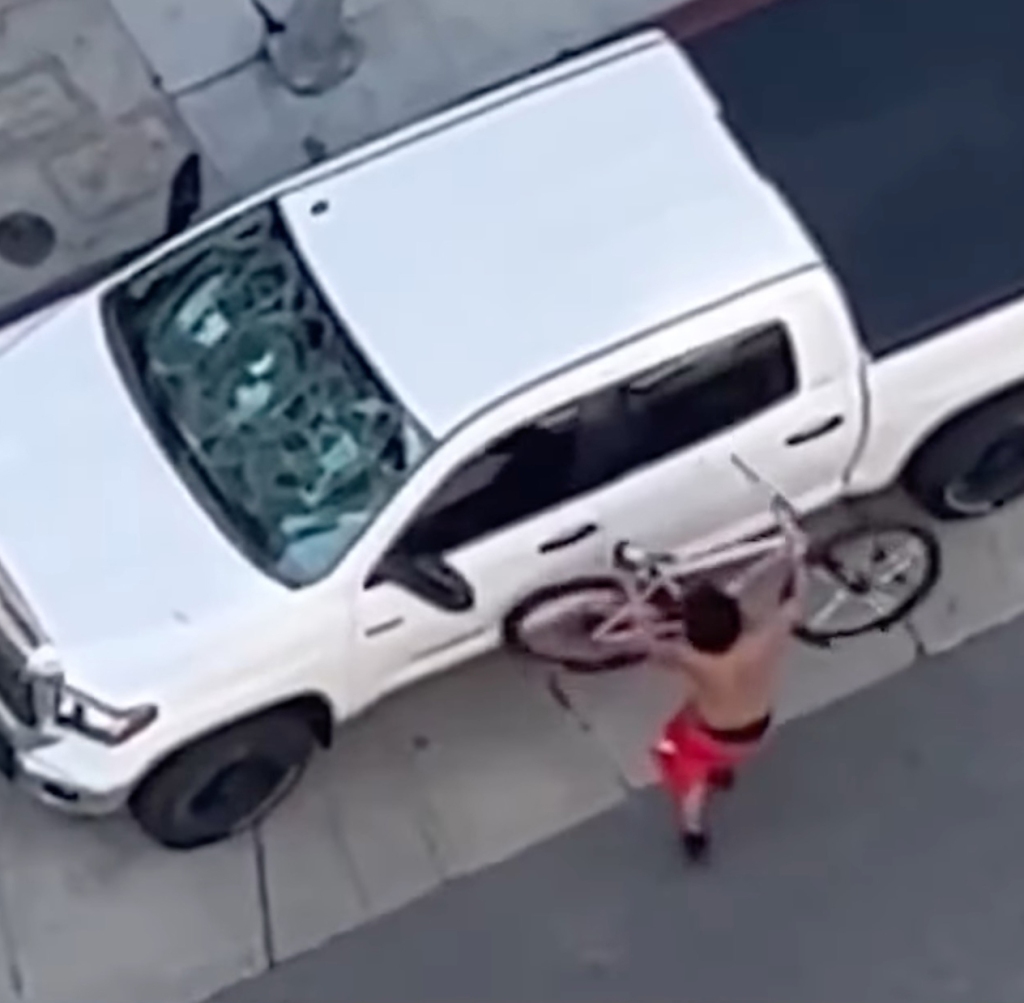 After the attack, one of the people could be seen using his bicycle to attack the man's vehicle. 