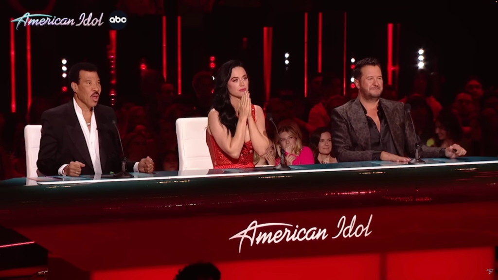 Katy Perry (center) and her co-judges Lionel Richie (left) and Luke Bryan (right) were brought to tears by Tongi by a moving rendition of "Making Memories of Us" originally sung by country star Keith Urban.