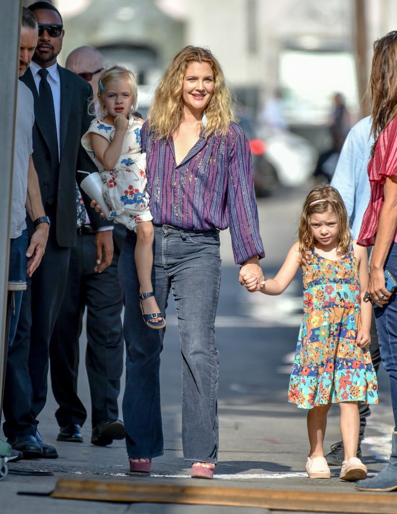 Drew Barrymore walks with her two daughters in this undated photo.