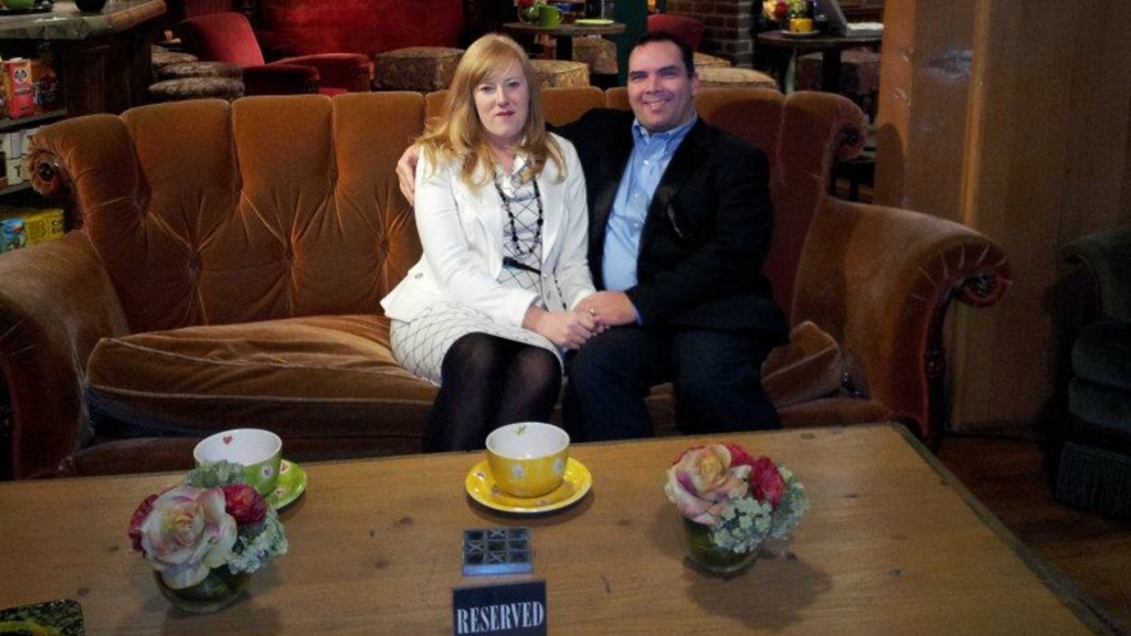 Kristine Barnett (left) and Michael Barnett posed together on a couch.