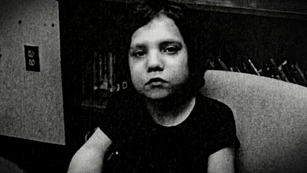 A black and white image of a scowling Natalia Grace Barnett.