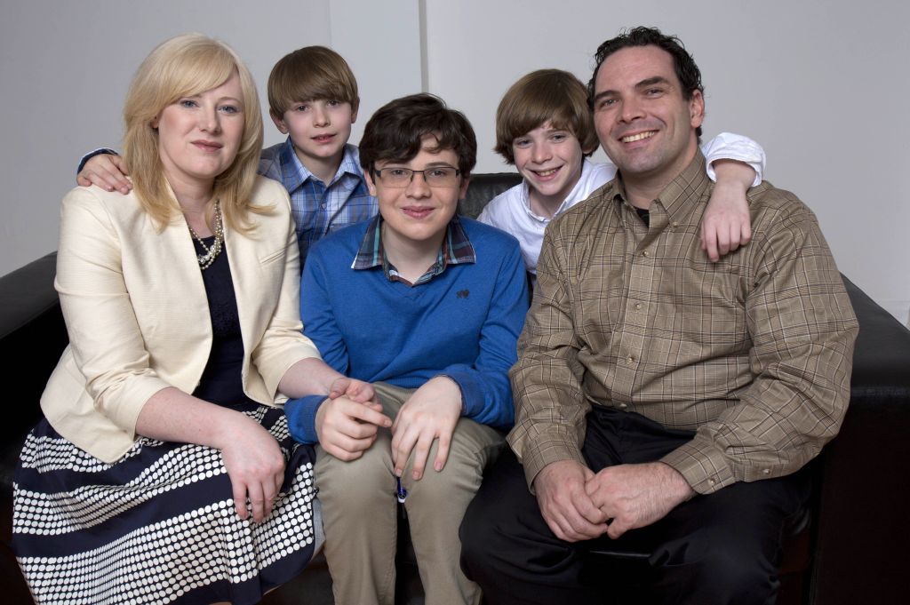 Kristine Barnett (far left) with sons Ethan, Jacob and Wesley, and Michael Barnett (far right).