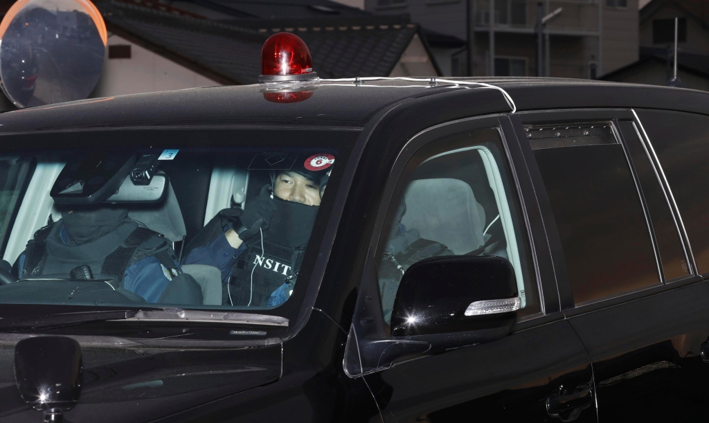 A vehicle carrying suspect Masanori Aoki is pictured