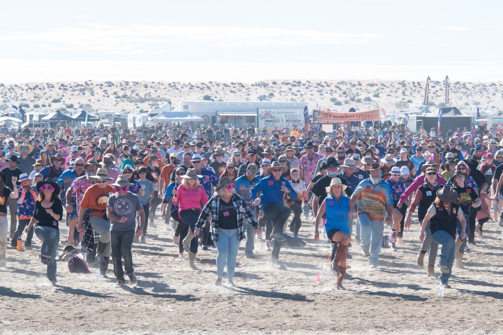 Dancers doing the Natbush at music festival on beach