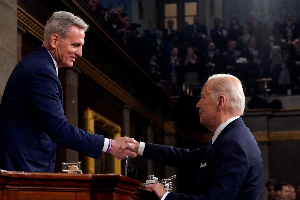 President Joe Biden shakes hands with House Speaker Kevin McCarthy.