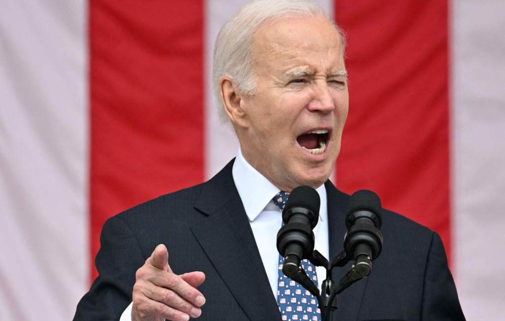 President Joe Biden speaking at podium