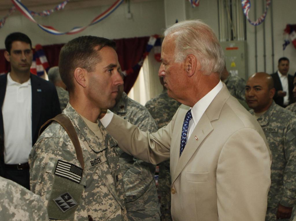 Joe Biden (right) and his son, Beau Biden wearing military uniform (right)