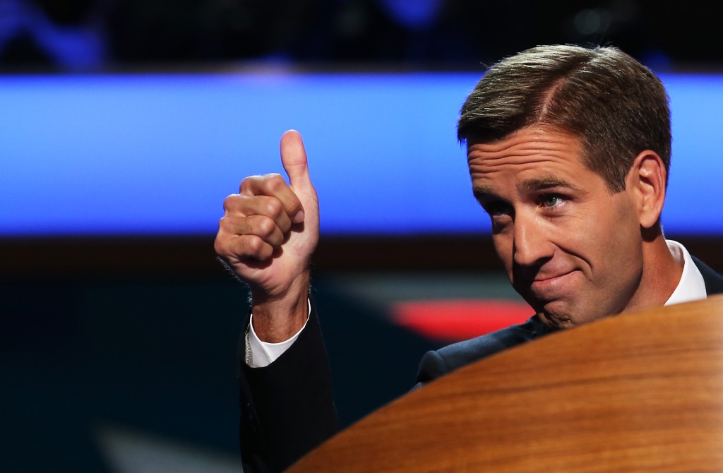 Beau Biden at podium giving a "thumbs up" gesture