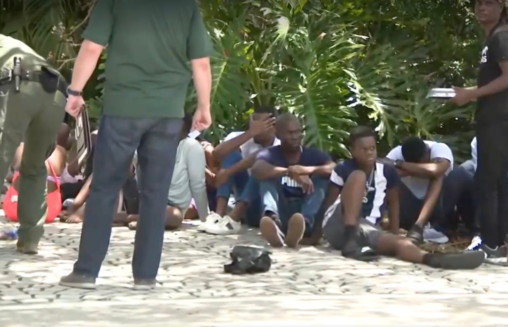 Haitian migrants being detained after landing in Florida over the weekend.