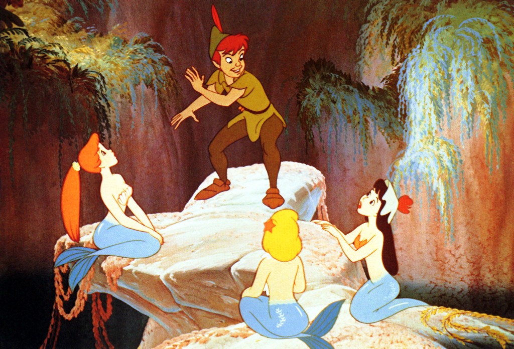 Peter Pan chats with the mermaids of the Mermaid Lagoon in "Peter Pan" (1953).