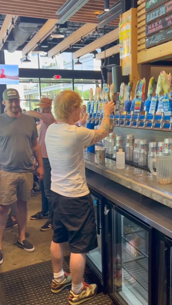 Ed Sheeran pouring beers 