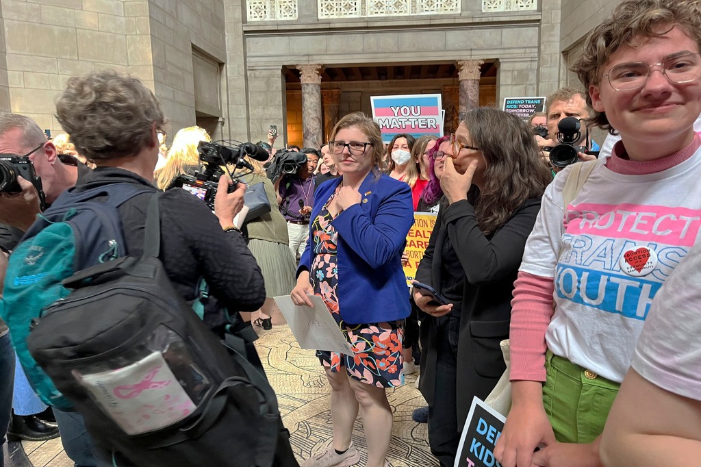 Nebraska state Sen. Machaela Cavanaugh stands among her supporters just after a vote in which the Nebraska Legislature passed a bill to ban abortion at 12 weeks and ban gender-affirming care in minors, on May 19, 2023 in Lincoln, Neb.