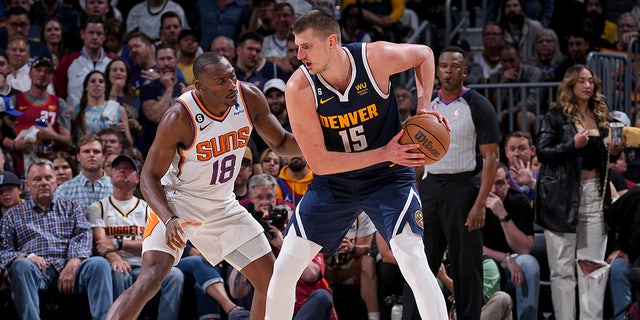 Nikola Jokic handles the ball during a playoff game