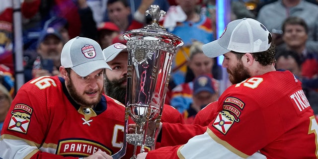 Matthew Tkachuck holds the trophy