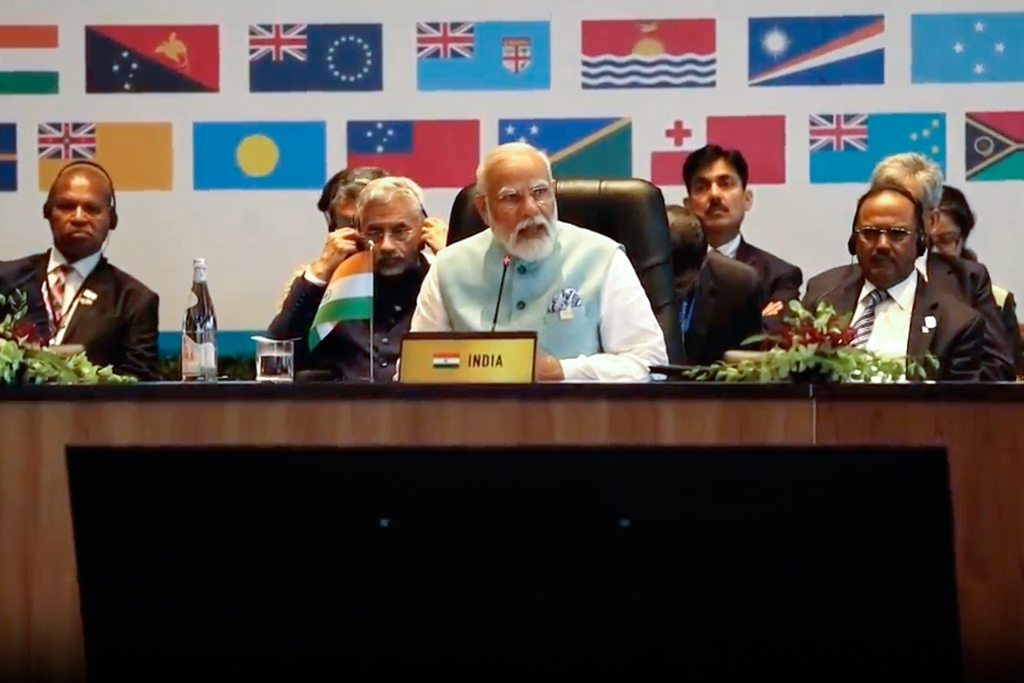 Indian Prime Minister Narendra Modi, center, addresses a meeting with Pacific Island leaders to discuss ways to better cooperate in Port Moresby, Papua New Guinea on May 22, 2023. 