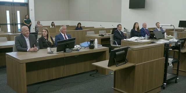 Gabby Petito's parents and their lawyer Pat Reilly on left