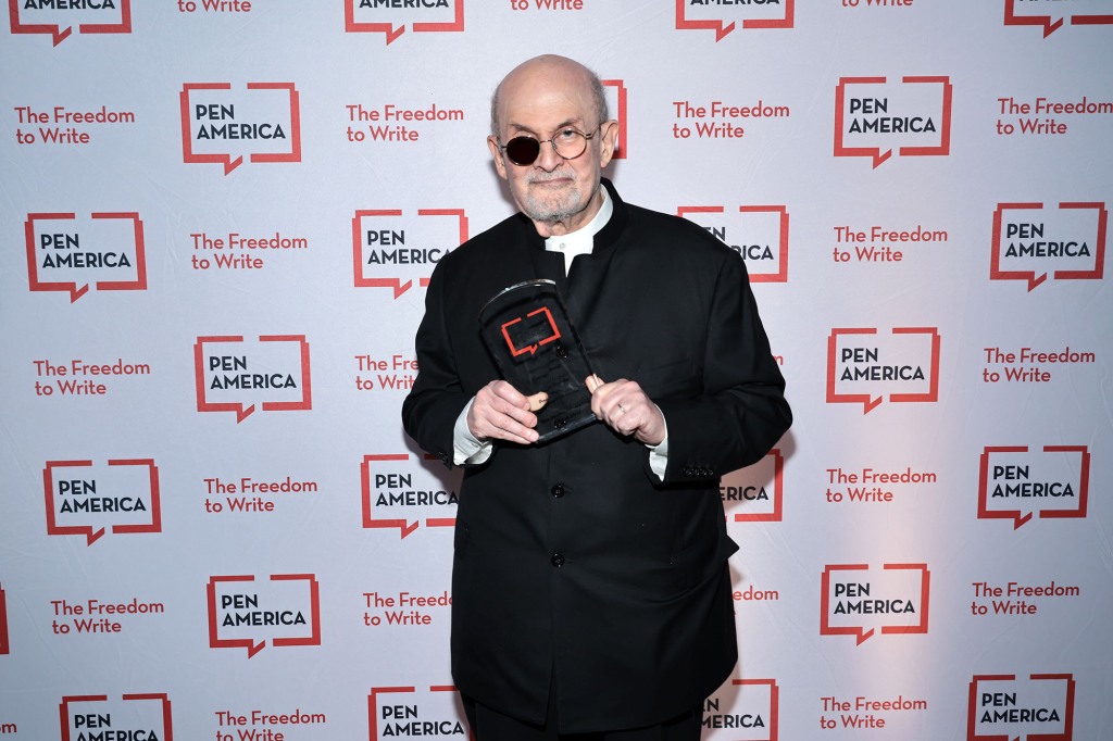 Rushdie poses with an award backstage during the 2023 PEN America Literary Gala at American Museum of Natural History on May 18, 2023 in New York City.