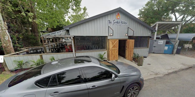 A car parked in front of the The Scratch Kitchen