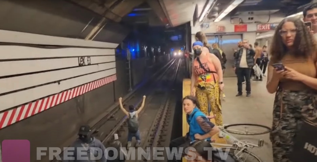 Protesters blocking the subway tracks in NYC.