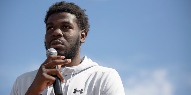 Former NMSU basketball player Shakiru Odunewu speaks during a news conference