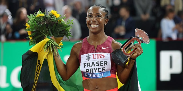 Shelly-Ann Fraser-Pryce celebrates win