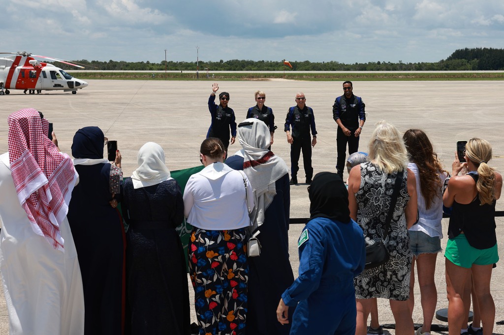 (L-R) Saudi astronaut Rayyanah Barnawi, former NASA astronaut Peggy Whitson, investor and pilot John Shoffner, and Saudi astronaut Ali AlQarni arrive before being brought to the SpaceX Falcon 9 rocket with the Crew Dragon spacecraft for launch from pad 39A at the Kennedy Space Center on May 21, 2023 in Cape Canaveral, Florida.