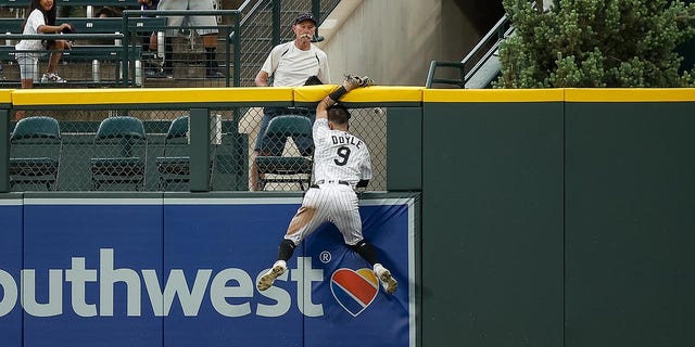 Brenton Doyle collides with the center field wall