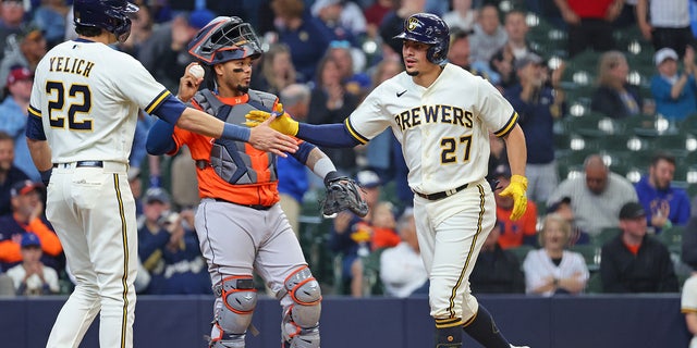 Willy Adames celebrates with teammates