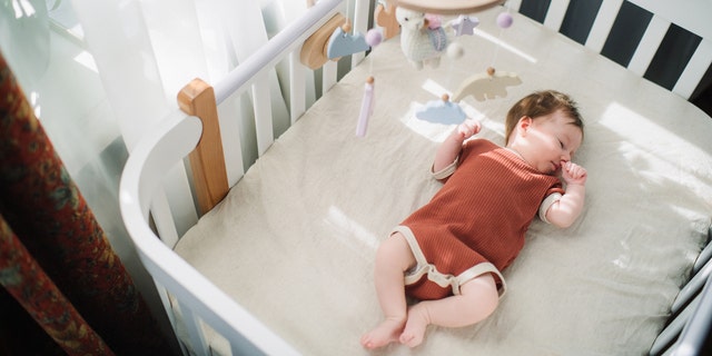 newborn baby in cradle