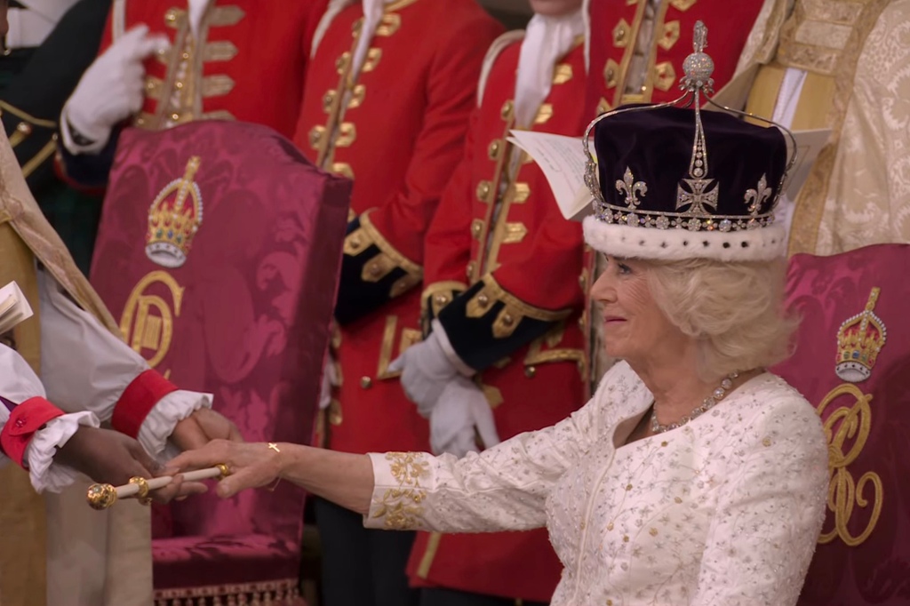 Queen Camilla smiles as she is bestowed with Queen Mary's Crown for her investiture.