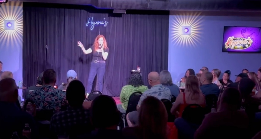 Comedian Chrissie Mayr released footage from her recent comedy set in Dallas, where she jokes about transgender dogma, including influencer Dylan Mulvaney.
