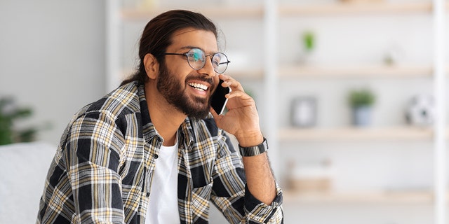 man smiling on phone