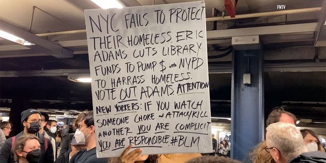 Protestors hold signs during Jodan Neely protest in New York City