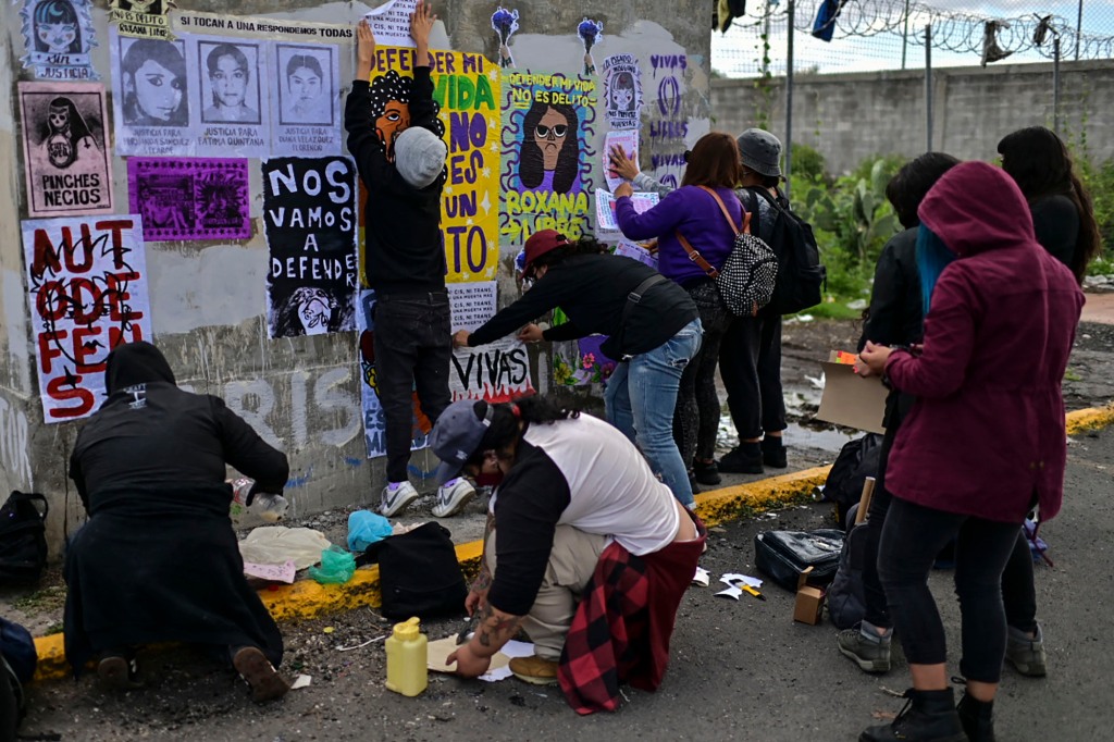 Women activists take part in a protest in support of Roxana Ruiz Santiago, 21, accused of murder after she killed a man when defending herself from a rape, at the Bordo court in Ciudad Nezahualcoyotl, Mexico State, on August 23, 2021.