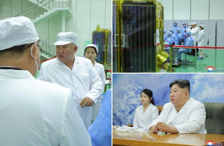North Korea shows Kim Jong Un examining a military spy satellite