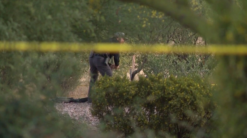 Investigators in Phoenix are spotted at the scene where Lauren Heike went hiking. 