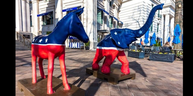 Democratic donkey and Republican elephant statues symbolize America's two-party political system in front of the Willard Hotel in Washington, D.C.