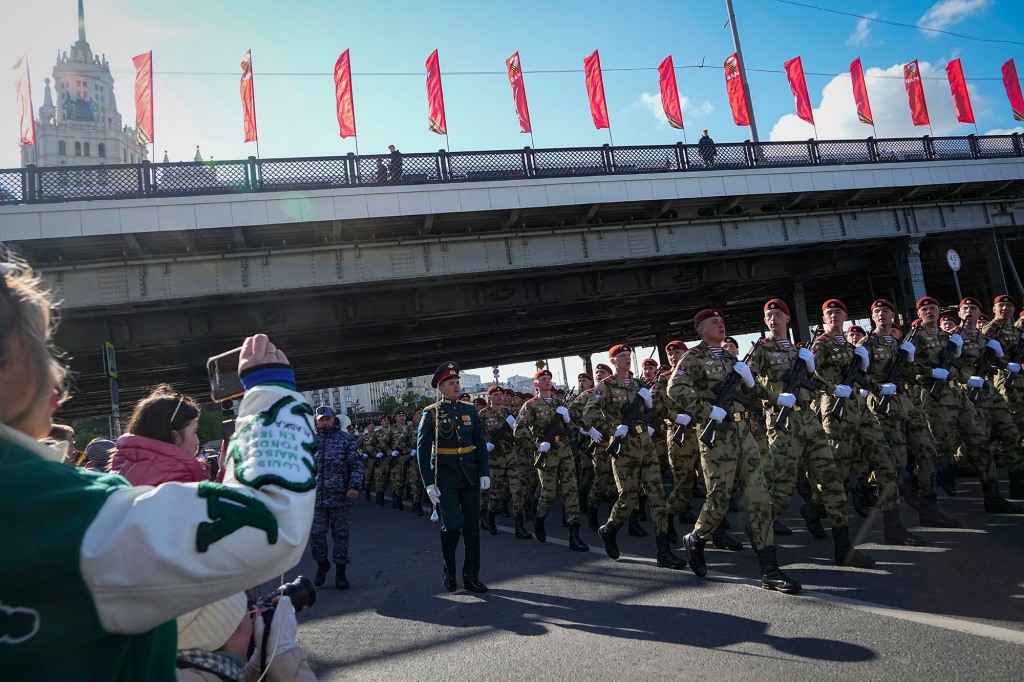 Russian soldiers march toward Red Square to attend a dress rehearsal for the Victory Day military parade in Moscow, Russia, Sunday, May 7, 2023. 