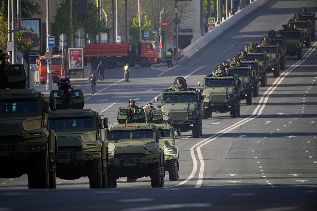 Military vehicles move toward Red Square to attend a Victory Day military parade in Moscow, Russia, Tuesday, May 9, 2023, 