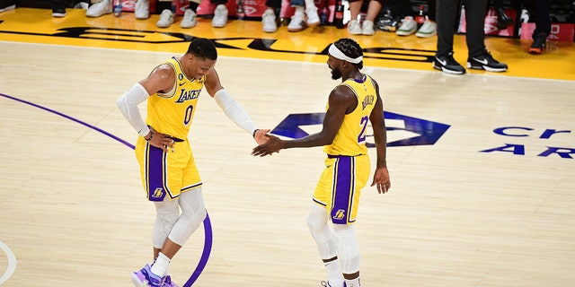 Russ and Pat Bev high five