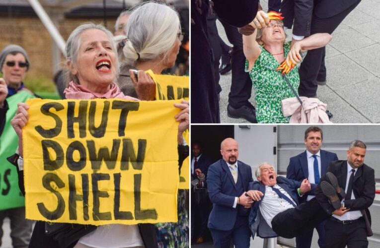Climate protesters dragged from Shell shareholder meeting