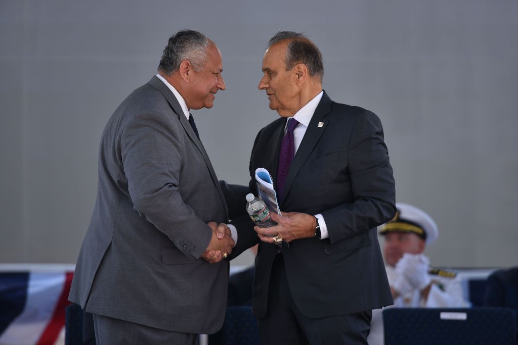 Secretary of the Navy Carlos Del Toro and Joe Torre at the commissioning ceremony at Pier 88 in NYC.